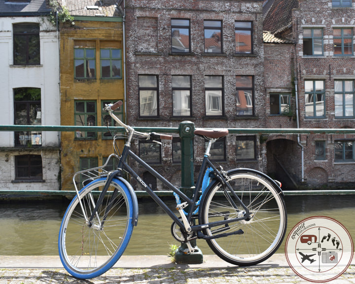 Bike tied up along the River, Lys / Leie, Ghent / Gent, Belgium; Belgian Cities You Must Visit