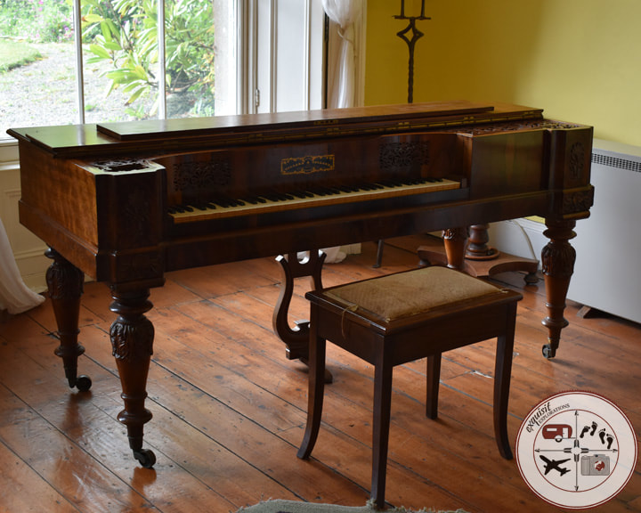 Piano in Ardgillan Castle; 13 castles you need to see; travel tips by exquisitEXPLORATIONS travel blog